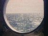 Mer prise d'un hublot de bateau - voyage
