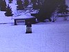 Motoneige en marche sur Lac Rond enneigé 