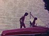 Adolescent et petite fille qui se baignent et s'amusent au bout du quai; puis, l'ado court avec la petite fille sur les épaules sur le terrain(beau plan d'amusement entre grand frère et petite soeur)
