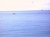 Percé - le village, la plage, le rocher, les mouettes, les vagues, les barques de pêcheurs, mouettes sur lampadaire
