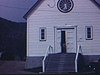 Panneau routier «Ste-Rose-du-Nord» - petite église, famille et religieuses qui sortent de l'église, puis sortie des adultes