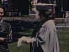 Graduation d’une jeune femme, des femmes l’entourent, elles portent toutes de beaux habits, une religieuse, un homme vide une boite d’objets par terre et cherche quelque chose - beaux plans de famille